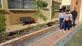 Cput 084914 : Landscape Architecture students Deidre Goeieman, Noma Ngcelwane, Inge Krigga and Kyle Goliath show off the finished courtyard.