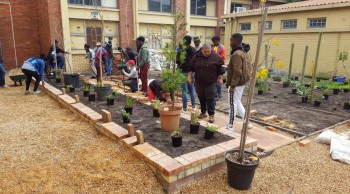 Cput 112026 The students constructing the brick edged flower garden.